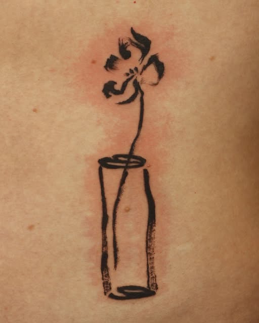 Vase tattoo on forearm