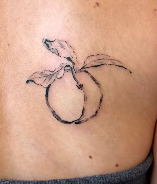 Peach tattoo on arm